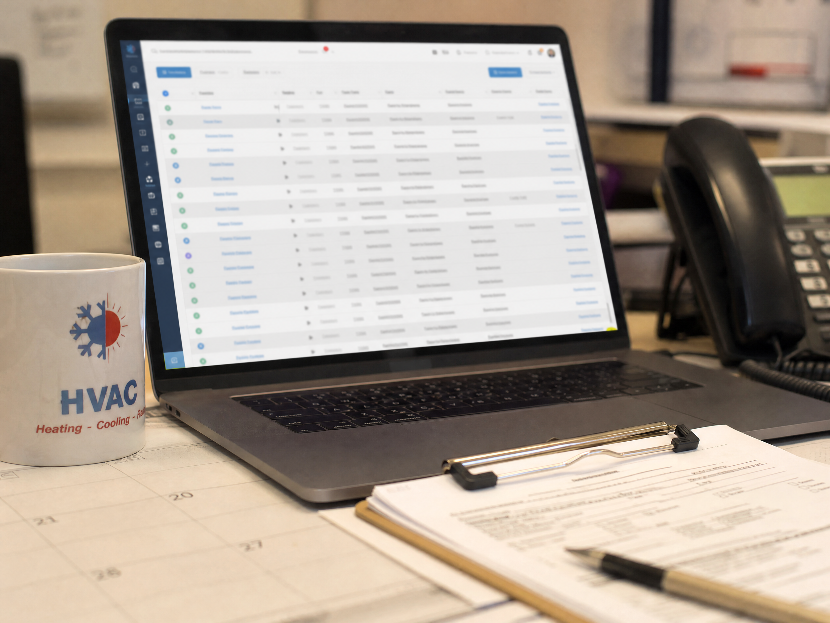 Laptop screen on a cluttered HVAC office desk showing a CRM dashboard full of old, inactive customer contact rows